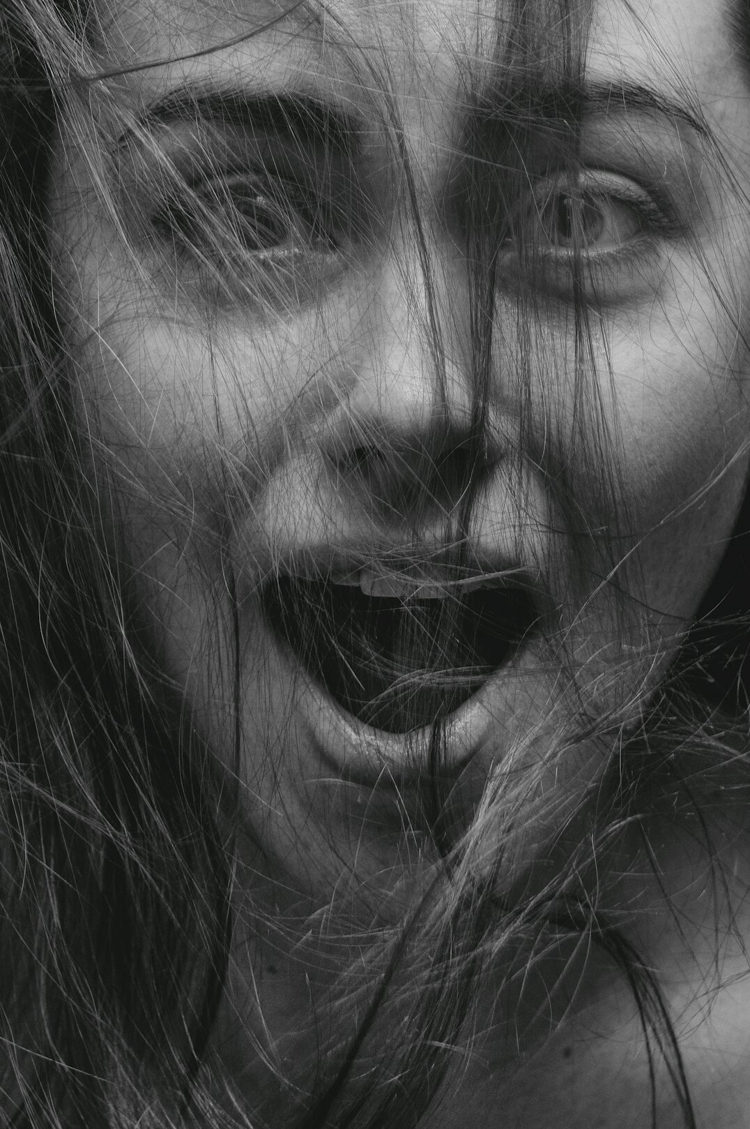 Portrait of a woman with long hair smiling